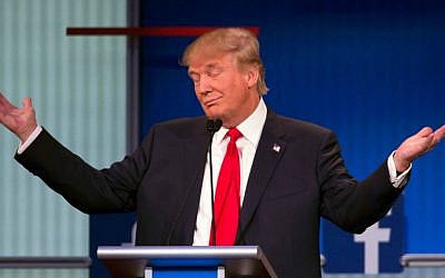 Republican presidential candidate Donald Trump gestures during the first Republican presidential debate at the Quicken Loans Arena Thursday, August 6, 2015, in Cleveland. (AP Photo/John Minchillo)