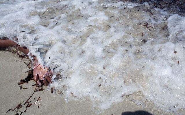 The arm of a dead migrant is seen at the waterfront of Zuwara, about 105 kilometers (65 miles) west of Tripoli, Libya, Friday, Aug. 28, 2015. (AP Photo/Mohamed Ben Khalifa) The arm of a dead migrant is seen at the waterfront of Zuwara, about 105 kilometers (65 miles) west of Tripoli, Libya, Friday, Aug. 28, 2015. (AP Photo/Mohamed Ben Khalifa)