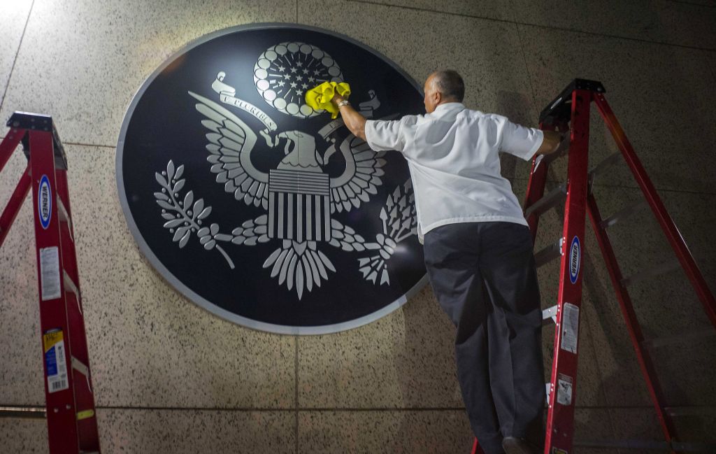 A worker wipes a representation of the The Great Seal of the United States at the newly opened US Embassy in Havana, Cuba, Friday, Aug. 14, 2015. (AP Photo/Ramon Espinosa) A worker wipes a representation of the The Great Seal of the United States at the newly opened US Embassy in Havana, Cuba, Friday, Aug. 14, 2015. (AP Photo/Ramon Espinosa)