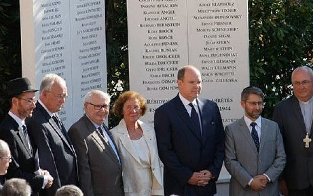 Prince Albert II, 3rd right, stands with French Nazi hunter Serge Klarsfeld, 3rd left, and his wife Beate, center, after unveiling a monument to Jews deported from the Riviera principality during World War II, as part of a larger effort to shed light at last on a troubling chapter in the countrys history, in a cemetery in Monaco, Thursday, Aug. 27, 2015. (Claude Paris/AP) Prince Albert II, 3rd right, stands with French Nazi hunter Serge Klarsfeld, 3rd left, and his wife Beate, center, after unveiling a monument to Jews deported from the Riviera principality during World War II, as part of a larger effort to shed light at last on a troubling chapter in the countrys history, in a cemetery in Monaco, Thursday, Aug. 27, 2015. (Claude Paris/AP)