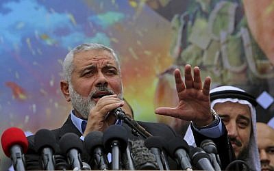 Palestinian top Hamas leader Ismail Haniyeh makes a speech to his supporters during a rally to commemorate the 27th anniversary of the Hamas militant group, at the main road in Jebaliya in the northern Gaza Strip, December 12, 2014 (AP/Adel Hana)