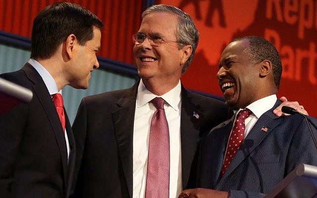 Republican presidential candidates (from left) Marco Rubio, Jeb Bush and Ben Carson talk during a break during the first Republican presidential debate at the Quicken Loans Arena in Cleveland, Thursday, Aug. 6, 2015. (AP Photo/Andrew Harnik) Republican presidential candidates (from left) Marco Rubio, Jeb Bush and Ben Carson talk during a break during the first Republican presidential debate at the Quicken Loans Arena in Cleveland, Thursday, Aug. 6, 2015. (AP Photo/Andrew Harnik)
