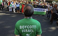 Protesters shout slogans during a rally in Paris, France, June 3, 2010, as they demonstrate against Israel's raid on a Gaza-bound aid ship; a man in the foreground wears a T-shirt calling for a boycott on Israel. (Jacques Brinon/ AP /File)