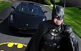 In this March 27, 2012, photo, Leonard Robinson, dressed as Batman, poses for a photo outside his home, in Owings Mills, Md. (Jonathan Newton/The Washington Post via AP)