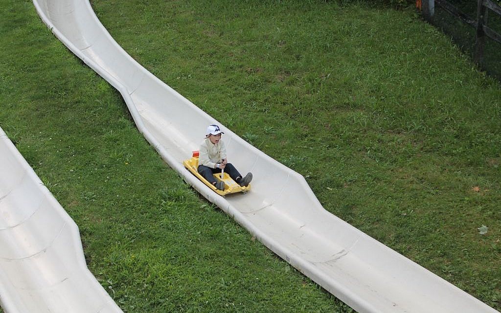 A child whips down an alpine slide at Jiminy Peak in August 2015. (JTA/Uriel Heilman)
