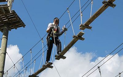 An ultra-orthodox child on a ropes course at Jiminy Peak in August 2015. (JTA/Uriel Heilman)