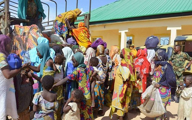 In this Thursday, July. 31, 2015 file photo, women and children rescued by Nigerian soldiers from Boko Haram extremists in the northeast of Nigeria arrive at the military office in Maiduguri. (AP Photo/Jossy Ola file) In this Thursday, July. 31, 2015 file photo, women and children rescued by Nigerian soldiers from Boko Haram extremists in the northeast of Nigeria arrive at the military office in Maiduguri. (AP Photo/Jossy Ola file)