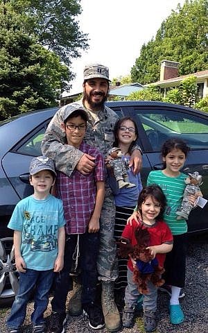 Chabad chaplain Rabbi Elie Estrin and his five children in Washington state. (courtesy)