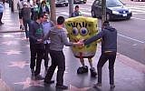 Jewish Yeshivah students unknowingly participate in a social experiment to help costumed actor who collapsed on Hollywood Boulevard on the Jimmy Kimmel show, August 25, 2015. (YouTube)