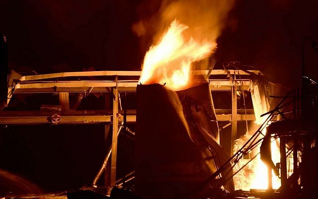 In this photo released by China's Xinhua News Agency, a chemical plant is on fire following an explosion in Zibo, east China's Shandong Province, Sunday, Aug. 23, 2015. (Guo Xulei/Xinhua via AP)