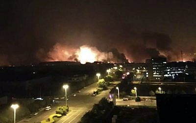 Smoke and fire erupt into the night sky after an explosion in the Binhai New Area in north China's Tianjin Municipality on Thursday Aug. 13, 2015. (Yue Yuewei/Xinhua via AP)