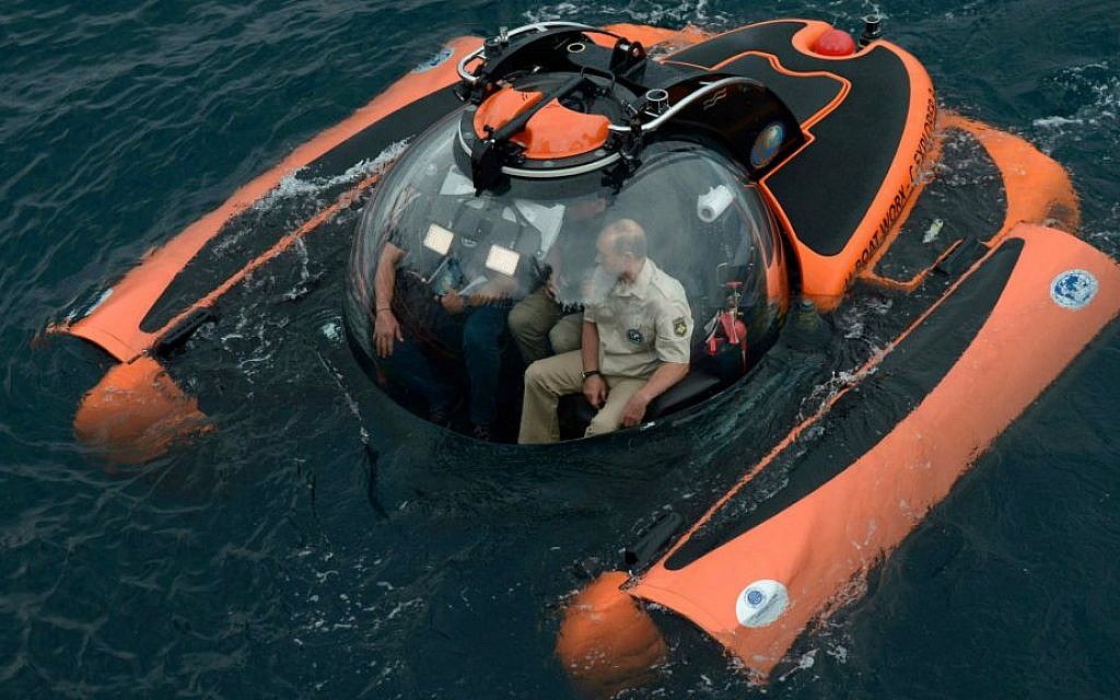 Russian President Vladimir Putin, right, sits on board a bathyscaphe as it plunges into the Black sea along the coast of Sevastopol, Crimea, August 18, 2015. (Alexei Nikolsky/RIA-Novosti, Kremlin Pool Photo via AP)