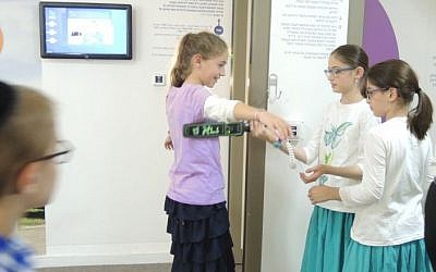 Children visit the Zomet Experience visitors center, a hands-on look at how electronics can be approved for Shabbat use. (Melanie Lidman/Times of Israel)