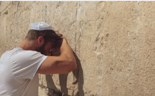 NFL star Julian Edelman praying at the Western Wall during a trip to Israel (screen capture via Youtube) NFL star Julian Edelman praying at the Western Wall during a trip to Israel (screen capture via Youtube)