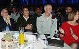President Reuven Rivlin (left), with Defense Minister Moshe Ya'alon (second left), outgoing IDF chief of staff Benny Gantz (second right), and his wife (right) seen during a farewell ceremony in honor of Gantz in Tel Aviv, February 15, 2015. (Amos Ben Gershom/GPO)
