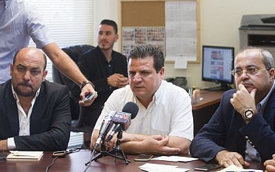 Leader of the Joint (Arab) List MK Ayman Odeh (center) seen with MK Masud Gnaim (left), and MK Ahmad Tibi (right) in the Knesset, Jerusalem, June 29, 2015. (Miriam Alster/Flash90)