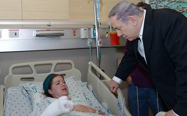 Prime Minister Benjamin Netanyahu visits Inbar Azrak, 27, who was wounded in Monday night's firebomb attack, at the Hadassah Ein Kerem Hospital in Jerusalem on August 4, 2015 (Amos ben Gershom/GPO) Prime Minister Benjamin Netanyahu visits Inbar Azrak, 27, who was wounded in Monday night's firebomb attack, at the Hadassah Ein Kerem Hospital in Jerusalem on August 4, 2015 (Amos ben Gershom/GPO)