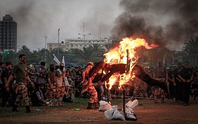 Palestinian youth demonstrate their skills during a graduation ceremony of a military-style camp organized by the Hamas movement, on August 5, 2015. (Aaed Tayeh/Flash90)