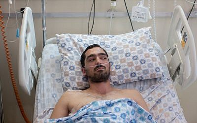Stab victim Yehuda Ben Moyal at the Shaare Zedek Medical Center in Jerusalem on August 10, 2015 (Yonatan Sindel/Flash90)