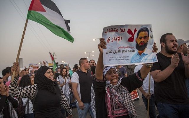 Demonstrators gather in support of Palestinian hunger striker Mohammad Allaan, in front of the Barzilai Medical Center in the southern Israeli city of Ashkelon on August 16, 2015. (Hadas Parush) Demonstrators gather in support of Palestinian hunger striker Mohammad Allaan, in front of the Barzilai Medical Center in the southern Israeli city of Ashkelon on August 16, 2015. (Hadas Parush)