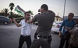 Palestinians protesters clash with Israeli police during a demonstration in Ashkelon on August 16, 2015.  (Hadas Parush/Flash90)