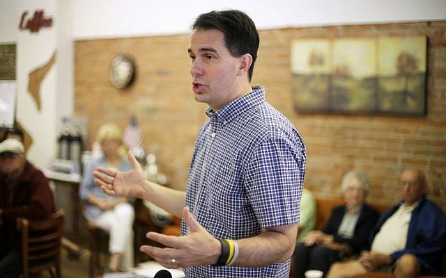Republican presidential candidate Wisconsin Gov. Scott Walker speaks during a meet and greet with local residents in Greenfield, Iowa, August 27, 2015. (AP/Charlie Neibergall) Republican presidential candidate Wisconsin Gov. Scott Walker speaks during a meet and greet with local residents in Greenfield, Iowa, August 27, 2015. (AP/Charlie Neibergall)