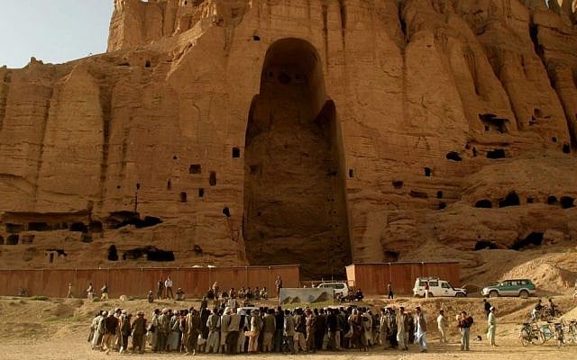 In this Wednesday, Aug. 24, 2005, file photo, villagers gather to watch a theater play in front of the empty seat of the Buddha that was destroyed by the Taliban in Bamyan, central Afghanistan. (AP Photo/Tomas Munita, File) In this Wednesday, Aug. 24, 2005, file photo, villagers gather to watch a theater play in front of the empty seat of the Buddha that was destroyed by the Taliban in Bamyan, central Afghanistan. (AP Photo/Tomas Munita, File)