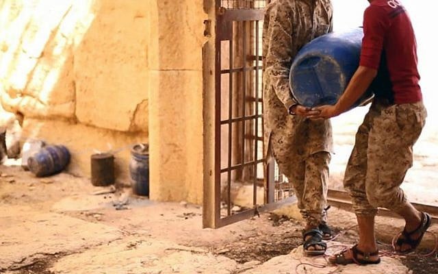Undated file photo released August 25, 2015, on a social media site used by Islamic State shows its fighters laying explosives in the 2,000-year-old temple of Baalshamin in Syria's ancient caravan city of Palmyra. (Islamic State social media account via AP) Undated file photo released August 25, 2015, on a social media site used by Islamic State shows its fighters laying explosives in the 2,000-year-old temple of Baalshamin in Syria's ancient caravan city of Palmyra. (Islamic State social media account via AP)