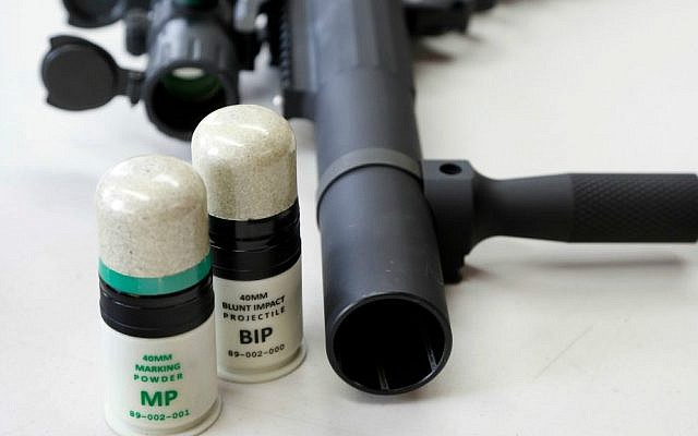 In this Thursday, July 30, 2015 photo, a launcher is displayed on a table next to cartridges that utilize 40 mm Blunt Impact Projectiles at Micron Products, Inc., in Fitchburg, Massachusetts. (AP Photo/Steven Senne) In this Thursday, July 30, 2015 photo, a launcher is displayed on a table next to cartridges that utilize 40 mm Blunt Impact Projectiles at Micron Products, Inc., in Fitchburg, Massachusetts. (AP Photo/Steven Senne)