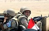 Egyptian army soldiers patrol the Cairo-Ismailia desert road in Egypt, August 6, 2015. (AP Photo/Amr Nabil)