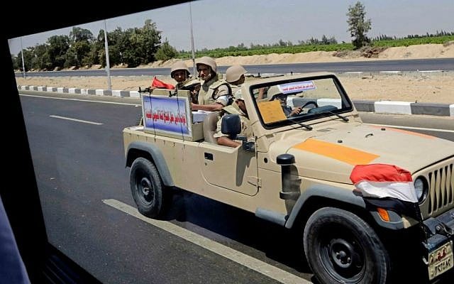 Egyptian army soldiers patrol the Cairo-Ismailia desert road in Egypt, Thursday, Aug. 6, 2015. (AP Photo/Amr Nabil)
