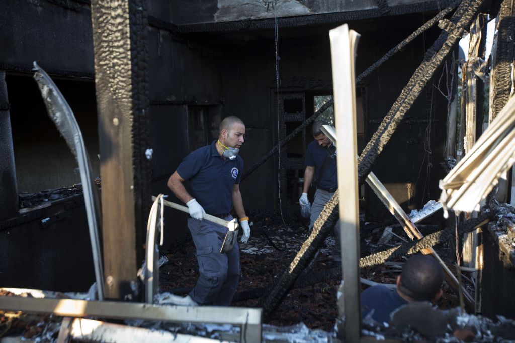 Israeli policemen inspect a house after it was torched in a suspected attack by Jewish terrorists killing an 18-month-old Palestinian child, at Duma village near the West Bank city of Nablus, Friday, July 31, 2015. (AP Photo/Majdi Mohammed) Israeli policemen inspect a house after it was torched in a suspected attack by Jewish terrorists killing an 18-month-old Palestinian child, at Duma village near the West Bank city of Nablus, Friday, July 31, 2015. (AP Photo/Majdi Mohammed)