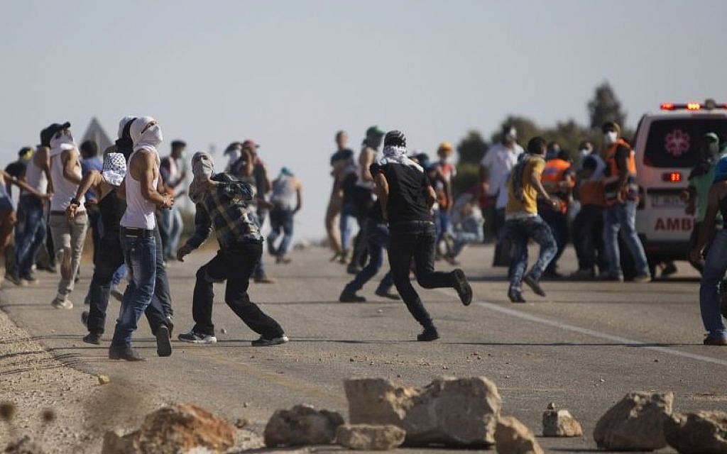 Palestinians clash with Israeli security forces after the funeral of Palestinian Saad Dawabsha, 32, in the West Bank village of Duma near Nablus on Saturday, Aug. 8, 2015. (AP Photo/Majdi Mohammed)
