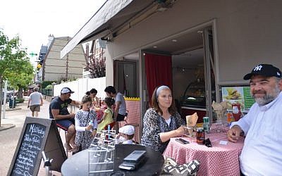 Nadia and Shimon Wilhelm at a kosher restaurant in the French resort town of Deauville, July 24, 2015. (Cnaan Liphshiz/JTA)