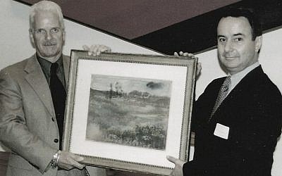 Brothers Nick and Simon Goodman holding a reclaimed Degas landscape, Chicago, 1998. (Courtesy of Goodman family)