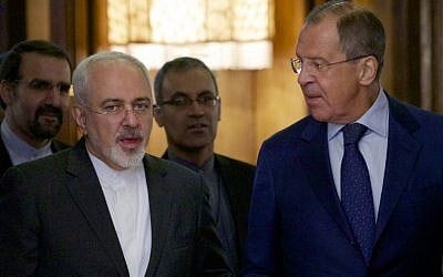 Iranian Foreign Minister Mohammad Javad Zarif, left, chats with Russian Foreign Minister Sergey Lavrov upon being welcomed by Lavrov for their meeting in Moscow, Russia, on Monday, August 17, 2015. (AP/Ivan Sekretarev)