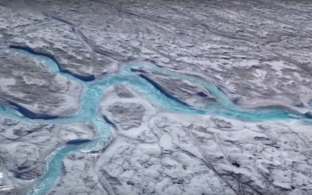 NASA scientists say melting ice sheets like this one in Greenland, are melting faster than ever, and oceans are warming and expanding much more rapidly than they have in years past. (Screen shot: YouTube)