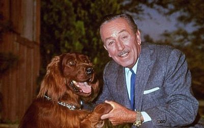 In this Dec. 23, 1965, file photo, Walt Disney poses for a photo with an Irish setter. Talking to TV critics Sunday, Aug. 2, 2015, about PBS' "American Experience" September documentary on Disney, composer Richard Sherman (Disney's "Mary Poppins," "The Jungle Book") dismissed lingering criticism of Disney. Disney was a complex figure, both celebrated and condemned, but allegations that he was a rabid anti-Semite are unproven, Disney experts said. (AP Photo, File)