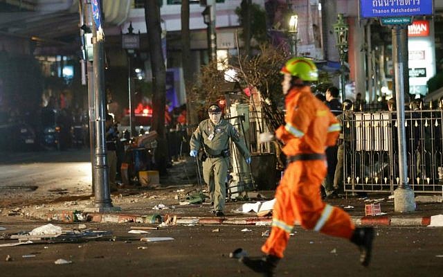 Emergency personnel work at the scene after an explosion in central Bangkok, Monday, Aug. 17, 2015. (AP Photo/Sackchai Lalit)