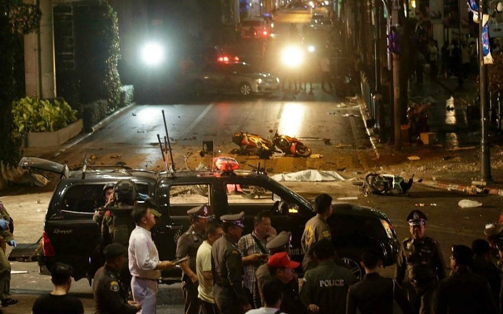 Officials close off an intersection after an explosion in central Bangkok, Monday, August 17, 2015. (AP Photo/Sackchai Lalit)