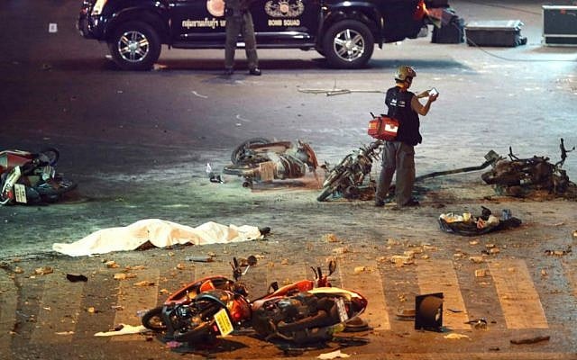 A policeman photographs debris from an explosion in central Bangkok, Thailand, Monday, Aug. 17, 2015. (AP Photo/Mark Baker) A policeman photographs debris from an explosion in central Bangkok, Thailand, Monday, Aug. 17, 2015. (AP Photo/Mark Baker)