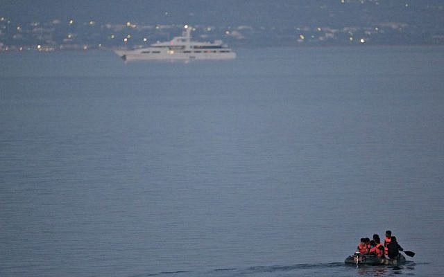 Migrants from the coastal town of Bodrum, Turkey, make their way to the Greek island of Kos, on Saturday, Aug. 15, 2015. (AP/Lefteris Pitarakis)