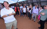 A pleased Yosef Abramowitz greets Bono at a Rwandan solar field this week (Courtesy Yosef Abramowitz)