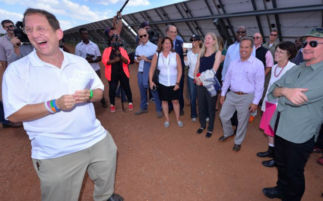 A pleased Yosef Abramowitz greets Bono at a Rwandan solar field this week (Courtesy Yosef Abramowitz) A pleased Yosef Abramowitz greets Bono at a Rwandan solar field this week (Courtesy Yosef Abramowitz)