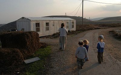 Illustrative picture of a family walking in the Adei Ad outpost, November 27, 2003 (Photo by Flash90)