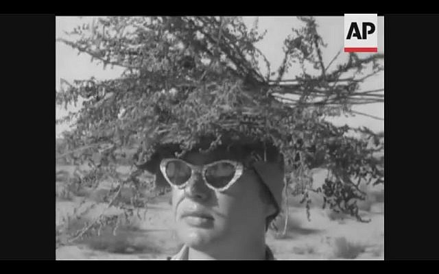 An IDF soldier practices camouflage in southern Israel in 1958 (Screenshot of newsreel footage from YouTube)