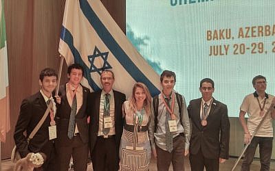 Members of the team representing Israel in the International Chemistry Olympiad in Baku, Azerbaijan July 30 2015. (R to L) Itai Zvieli, Ran Solan, Dr. Izena Nigel-Ettinger, Professor Zeev Gross, Roni Aaronson, and Nadav Ginnosar (Courtesy)
