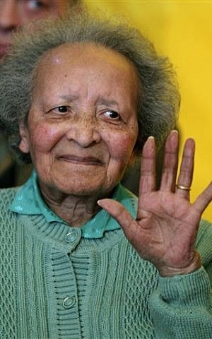 In this Monday, Dec. 12, 2011 file photo, Belgian nurse Augusta Chiwy gestures after receiving an award for valor from the US Army, in Brussels.  (Yves Logghes/AP)