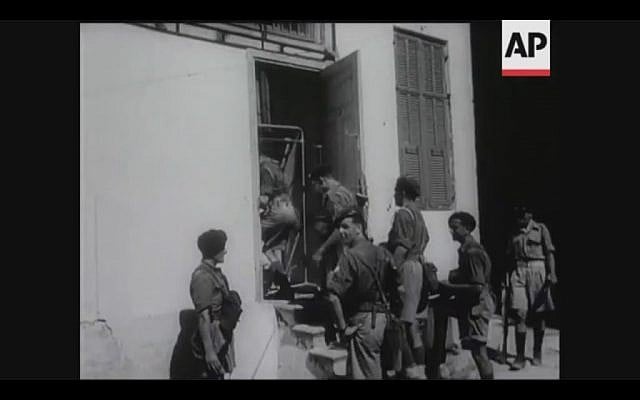 British soldiers search a house in Tel Aviv for terrorists during a four-day curfew in 1946 (Screenshot of newsreel footage from YouTube)
