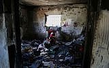 Inside the Dawabsha home in Duma. A doll wrapped in a Palestinian flag rests in a stroller to honor Ali. (Eric Cortellessa/Times of Israel)